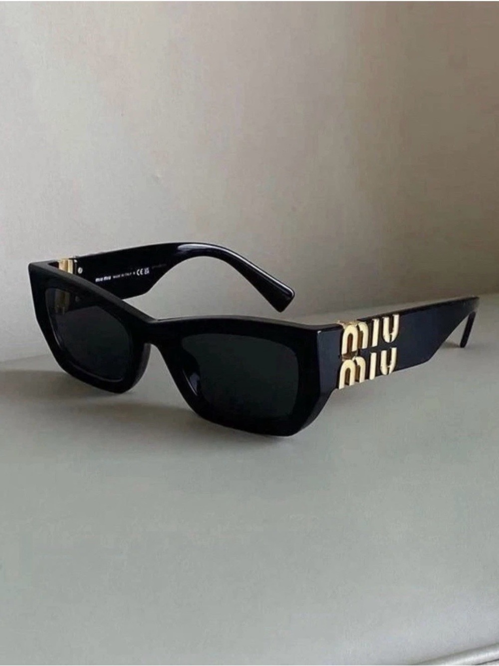Miu Miu Black Sunglasses with Gold Logo Temples
